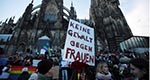 Merkel Toughens  Tone on Migrants as  Protesters Gather